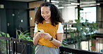 Laugh, text and woman in lobby with phone, online communication and comic post on chat app. Happy, digital and employee in office with technology, funny message and business meme on social media.