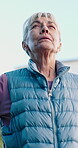 Calm, mindfulness and senior woman at park, breathing and thinking with self awareness or meditation. Retirement, wellness and old person with stress relief, low angle or zen with fresh air in nature