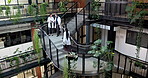 People, doctors and staircase at hospital with tablet, research and medical report for diagnosis. Team, walking and discussion on steps with digital, patient history and healthcare case for treatment