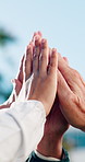 People, winning and team with high five in nature for collaboration, mission or trust in unity. Group, community or outdoor friends with hands together for solidarity, success or social cohesion