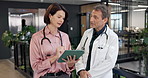 People, doctors and talking at hospital with tablet, research and medical report for diagnosis. Advice, team and discussion in workplace with digital, patient history and healthcare case for treatment