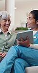 Talking, tablet and nurse with senior woman for consulting, healthcare and medical checkup. Retirement, nursing home and caregiver with happy person on tech for results, assisted living and wellness