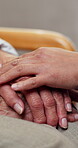 Comfort, old person and caregiver in home with holding hands, trust and empathy in elderly care. Compassion, senior woman or volunteer with security, support or understanding in retirement assistance