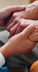 Comfort, nurse and old person in home with holding hands, understanding and empathy in elderly care. Compassion, patient and caregiver with security, retirement support and trust in medical service.