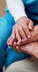 Empathy, nurse or old woman in home with holding hands, comfort or consoling for medical diagnosis. Health, elderly patient or caregiver with support, understanding or sympathy for evaluation results