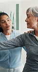 Senior, woman or stretch in clinic for physio, muscle injury or evaluation for functional movement. Rehabilitation, worker and happy pensioner in physical therapy, healing or assessment for mobility