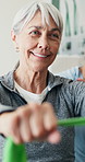 Happy, old woman and stretch with resistance band for physio, flexibility or functional screening. Clinic, worker and senior with equipment for physical therapy, posture correction or rehabilitation