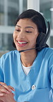 Woman, nurse and consultant with headset for Telehealth, online medical advice or conversation. Female person, doctor or health agent with mic for video call, virtual assistance or help in hospital
