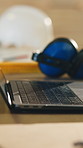 Laptop, carpentry or workshop with headphones, tools or gear for woodwork, schedule or supply chain. Empty, computer and equipment for wood production, distribution or furniture design in warehouse