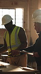 Carpenter, men and talk in workshop with woodwork, planning furniture design and project with timber. Manager, carpentry team and discussion in factory with PPE, lumber production and manufacturing.