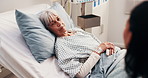 Visit, hospital and woman with senior mother in ward for conversation, bonding or care in morning. Checkup, talking and adult daughter with elderly patient for family support in clinical bed.