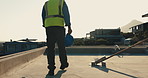 Thinking, construction and back of man on rooftop for inspection, property development and project. Architecture, engineering and person with helmet, thought and outdoor for infrastructure evaluation