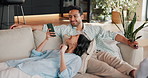 Happy, relax and couple on sofa with phone, internet and option on ecommerce website on weekend. Marriage, home and man with woman on tech for connection, bonding and watching tv together for love