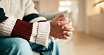 Anxiety, hands and man on sofa in home for stress, trauma and mental health in living room. Nervous, overthinking and person with stimming for phobia, panic attack or pressure for bad news in house.