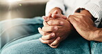 People, holding hands and love or empathy in home for connection, trust or understanding. Couple, affection and together for loyalty, partnership and help in house for kindness, respect or support