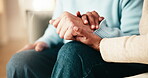 Couple, holding hands and support or care in home for connection, trust or understanding. People, affection and together for loyalty, partnership and help in house for kindness, respect or empathy