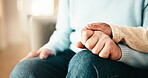 People, holding hands and care or empathy in home for connection, trust or understanding. Couple, affection and together for loyalty, partnership and help in house for kindness, respect or support