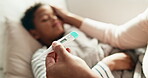 Hands, mother and child in home with thermometer, childcare and health monitor with flu symptoms. Sick, mom or kid in living room with tech, parent comfort or temperature check in illness assessment