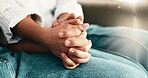 Couple, holding hands and support or empathy in home for connection, trust or understanding. People, affection and together for loyalty, partnership and help in house for kindness, respect or care