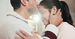 Couple, love and forehead kiss in home with smile, loyalty and relationship with soulmate connection. Flare, people dating and happy in house with affection, care and commitment to romantic partner.