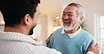 Laugh, happy and man with senior father in home with bonding, connection or good news together. Smile, love and adult son with elderly dad in living room for support, trust or family in house.