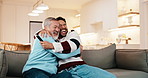 Hug, sports and man with senior father in home with watching game for bonding together. Happy, love and adult son with elderly dad for streaming tournament in living room with winning in house.