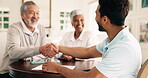 Finance, old couple or man in home with handshake, investment deal or credit offer in retirement. Happy, senior people or consultant with shaking hands, loan approval or agreement on pension fund.

