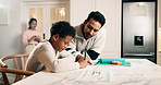 Dad, child and writing in house with homework, teaching knowledge or discussion for answer on quiz. Man, son and conversation in family home with school task, education or taking notes for assignment