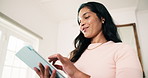 Woman, reading and remote work in home with tablet, research and consent for story submission. Smile, female person and freelancer in lounge with digital, editing grammar and approval for publication