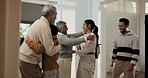 Grandparents, hug and child in home for greeting, family reunion and holiday arrival with smile. People, welcome and parents at house with generations, embrace kid and homecoming gathering for visit