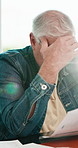 Senior, man and stress with documents in home for finance, retirement fund or pension application. Elderly, male person or checking paperwork with bad news for financial crisis or debt in house
