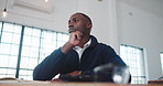 Architecture, thinking and black man in office for ideas, drawing and blueprint for building design. Creative, low angle and person with layout and planning for renovation, remodeling and sketch