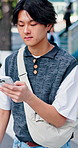 Walking, city and asian man with phone for travel, navigation app or outdoor location on crosswalk. Traveler, male person and checking smartphone for destination, sightseeing or commute in urban town