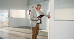 Construction, tablet or man on site with inspection, safety check or evaluation of building renovation. Review, walk or mature engineer with tech, progress track or compliance in remodeling project.