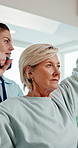 Physio, dumbbells and mature woman with exercise for rehabilitation, healing and orthopedic. Healthcare professional, patient and consultation with weights, physiotherapy or muscle wellness at clinic