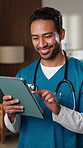 Doctor, smile and man with tablet in clinic, thinking and review test results on app and healthcare. Hospital, medical professional and happy person with tech, reflection and reading health report