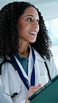 Healthcare, doctor and happy woman with tablet in hospital, thinking and review test results on app. Clinic, medical professional and person with tech, reflection and smile with treatment plan on web