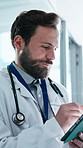 Doctor, writing and man with tablet in clinic, thinking and review test results on app or healthcare. Hospital, medical professional and happy person with tech, reflection and laughing with report