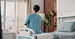 Back, thinking and woman on bed at hospital, vision and anticipation for surgery recovery. Thoughts, female person and patient in icu ward with reflection, inpatient and healthcare for rehabilitation