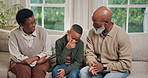 Grandparents, child and sofa with black family for bonding, love or conversation together in home. Grandpa, grandma or kid with smile or discussion on couch for holiday, weekend or support in house