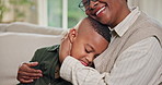 Mom, kid and black family with hug on sofa for love, care or bonding together in home. Happy, mother and smile with child, son or embrace on couch for comfort, weekend break or holiday in house