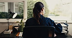 Back, woman and remote work in home office with paperwork, finance administration or internal audit. Accounting, contractor or person by house window with documents, financial bookkeeping and review.