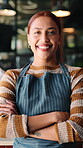Hospitality, face and barista in cafe with arms crossed, bistro career and pride as startup founder. Happy, woman and small business owner with confidence, restaurant worker and about us in catering.