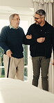 Balance, cane and old man with physiotherapist in clinic for consulting, help or rehabilitation. Aid, chiropractor and senior patient with walking stick in office for healing, recovery or therapy