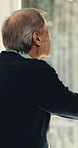Window, thinking or senior man in home with view, perspective or ponder with nostalgia in retirement. Reflection, pension and elderly person with memory at house, mindset or contemplating life choice