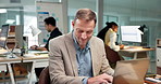 Businessman, finance or typing with laptop in office for accounting, company budget or expenses. Man, employee or accountant with computer for online investment or financial planning in workplace
