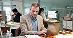 Businessman, finance or laptop with documents in office for accounting, company budget or expenses. Man, employee or accountant with paperwork or computer for financial planning or bills in workplace