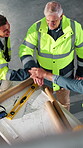Architect, blueprint and hand stack with team, above or motivation for project on construction site. Civil engineer, support and collaboration with colleagues, applause or happy people with paperwork