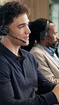 Call center, happy and man in agency with headset, contact us or telecom advice in crm service. Coworking, microphone and agent in office with tech, online assistance or advisory in client support.