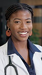 Happy, black woman and doctor in hospital with face, medical advice and cardiologist for wellness. Portrait, female person and surgeon in workplace for cardiology, patient care and healthcare service